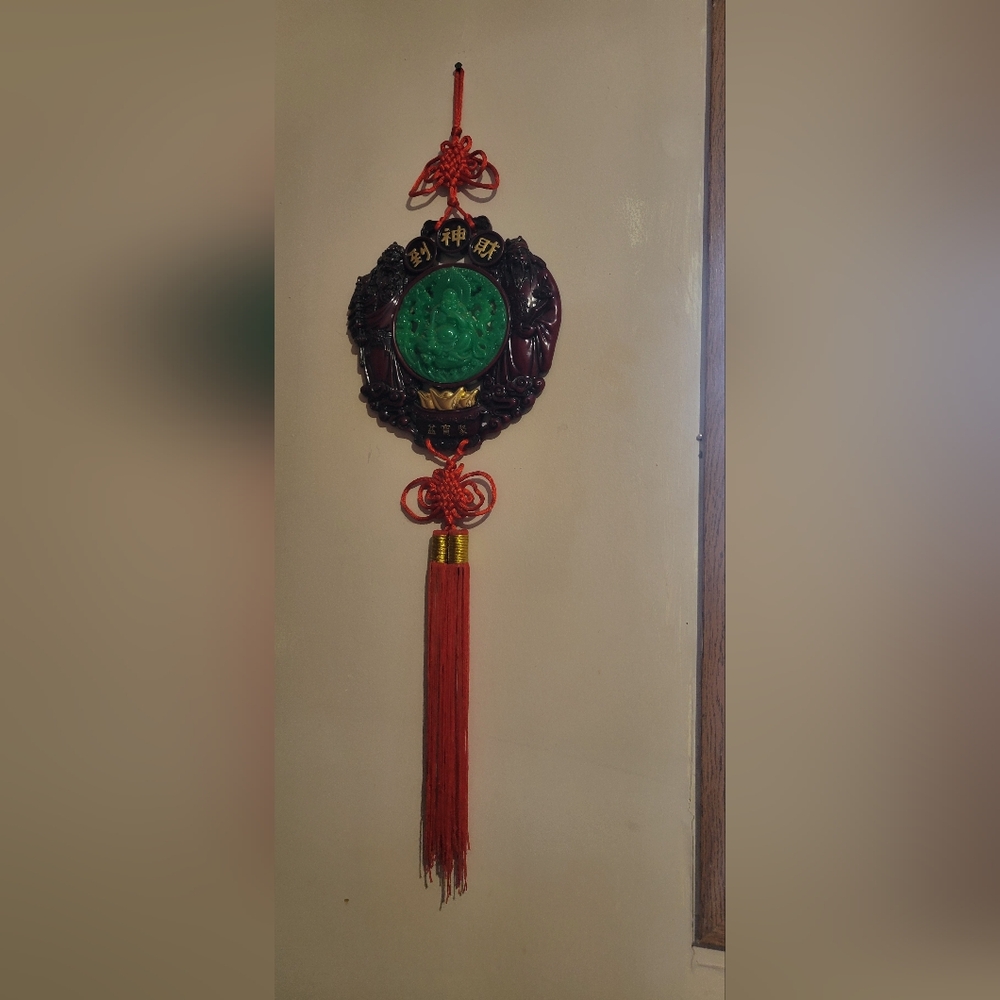Decorative Wall Hanging with Green Medallion and Red Tassel